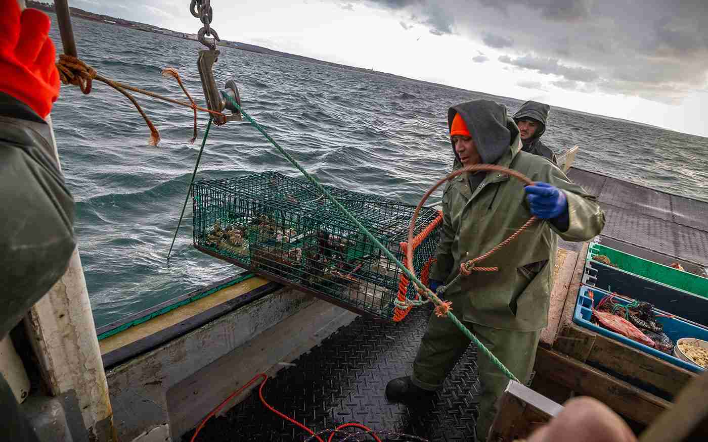 Fishermen from Indian Brook First Nation, Nova Scotia, checking lobster traps.